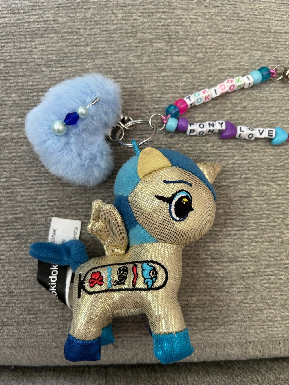 TOKIDOKI Gold & Blue Pony Plush Keychain with Light Blue Pom and Beads 4”
